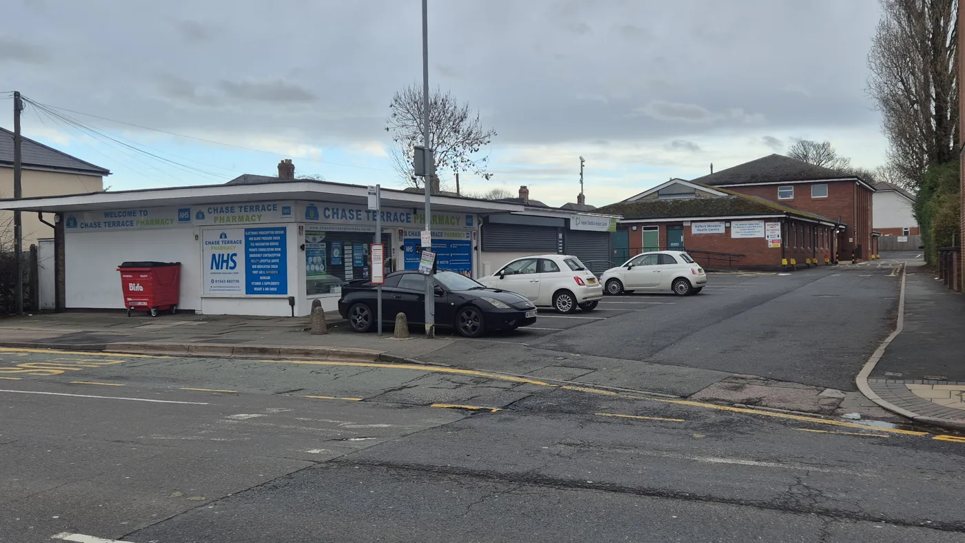 Salters Meadow Health Centre, the low brick building beyond Chase Terrace Pharmacy at Sankey's Corner. Its services would move to the proposed new health centre off Milestone Way