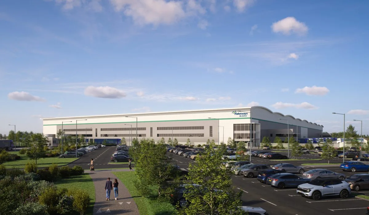 Computer-generated image of the proposed Palletways headquarters at Fradley: a long white warehouse with a green band, a glazed office entrance under the Palletways logo, a large staff car park in front and HGVs in the yard to the side.